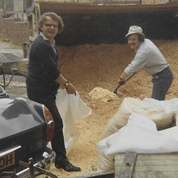 Archive photograph of shavings being bagged by hand in the early days of Platts.